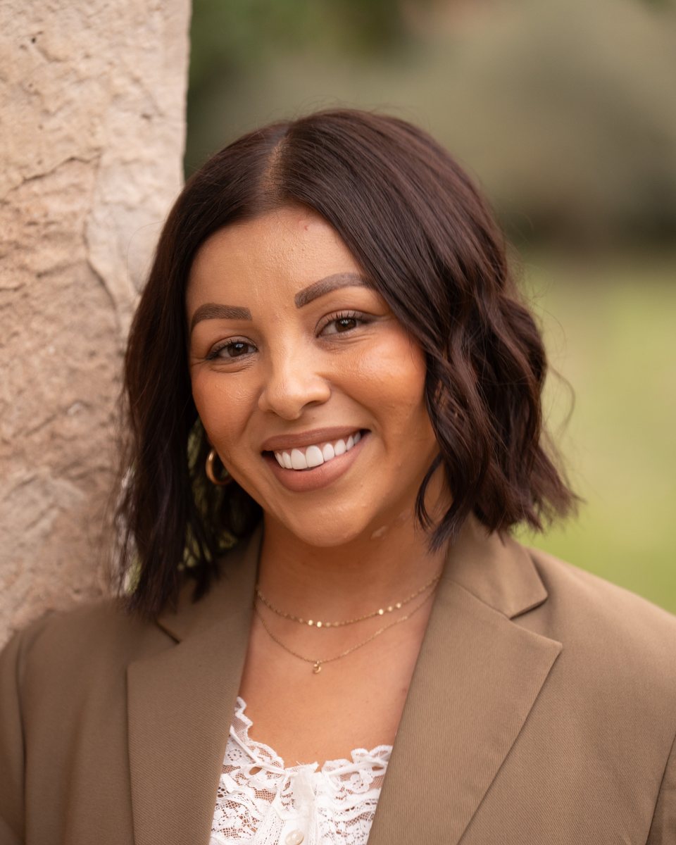 Outdoor portrait of a woman in a tan blazer